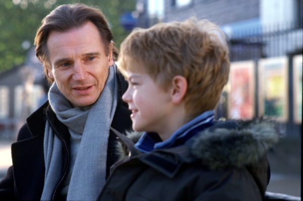 Sam (THOMAS SANGSTER) opens up to his stepfather Daniel (LIAM NEESON) in Richard Curtis? romantic comedy movie Love Actually. 	Photo Credit: Peter Mountain. ©2003 Universal Studios.